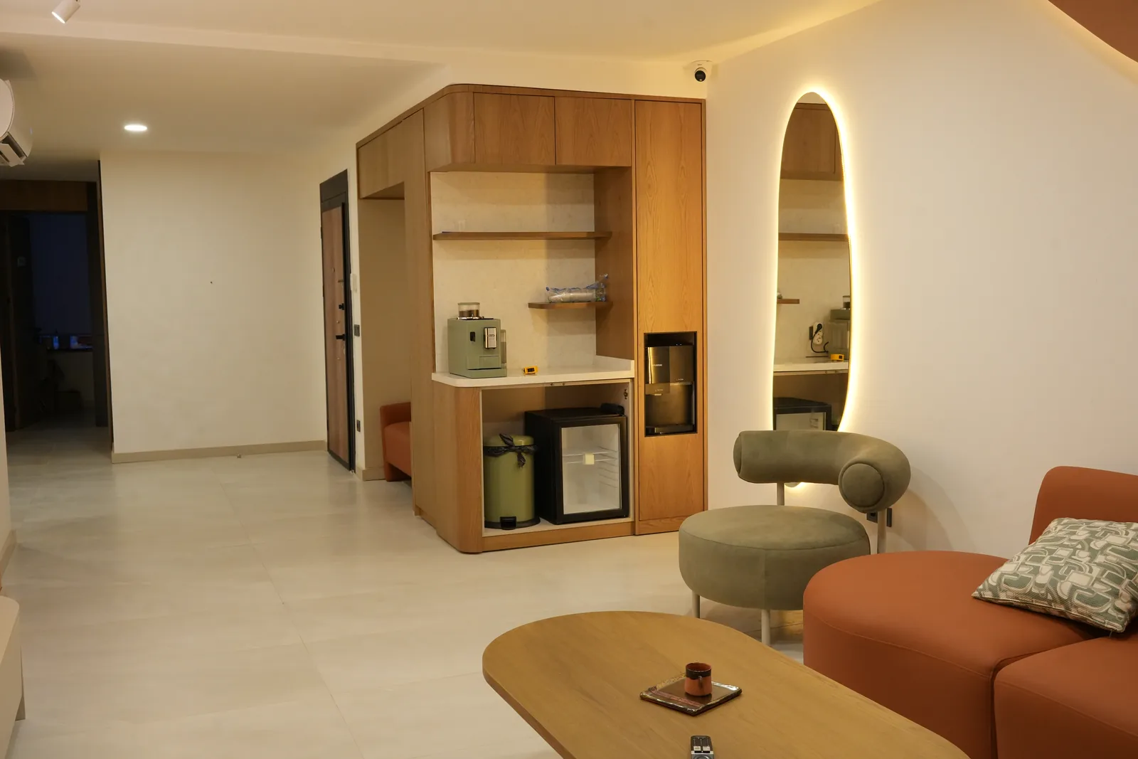 Refreshment corner with coffee station, mirror and seating